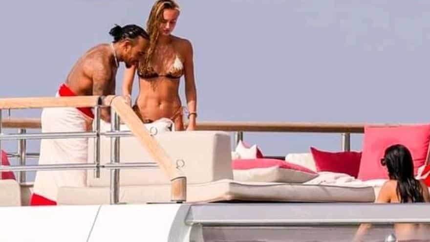 Formula 1 driver Lewis Hamilton rides a yacht along Ibiza’s coastline