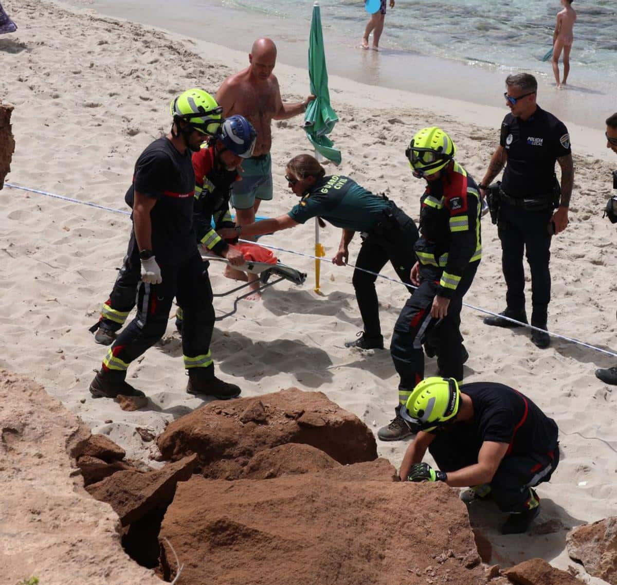 Firefighters, Guardia Civil and Local Police at the site of the landslide.