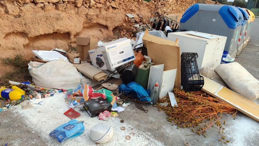 Garbage accumulates next to the containers in Formentera