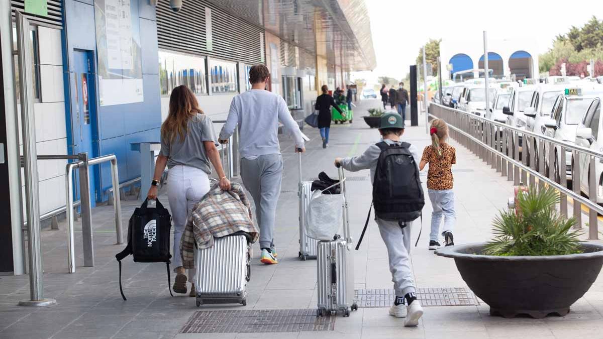 Tourists at Ibiza airport, little by little